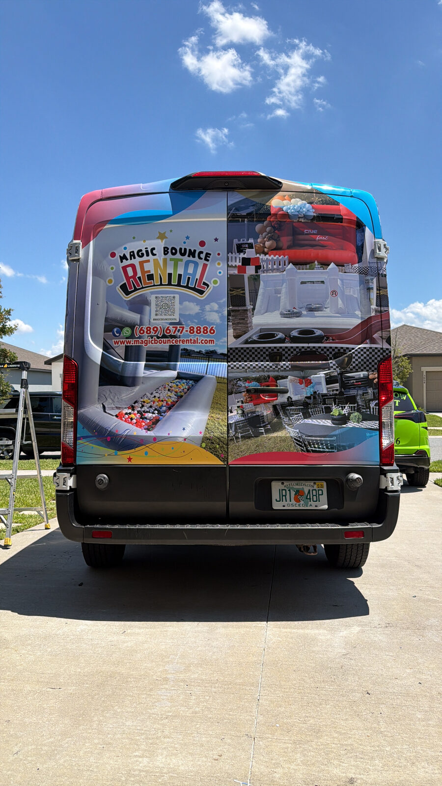 Magic Bounce Rental commercial van wrap rear view